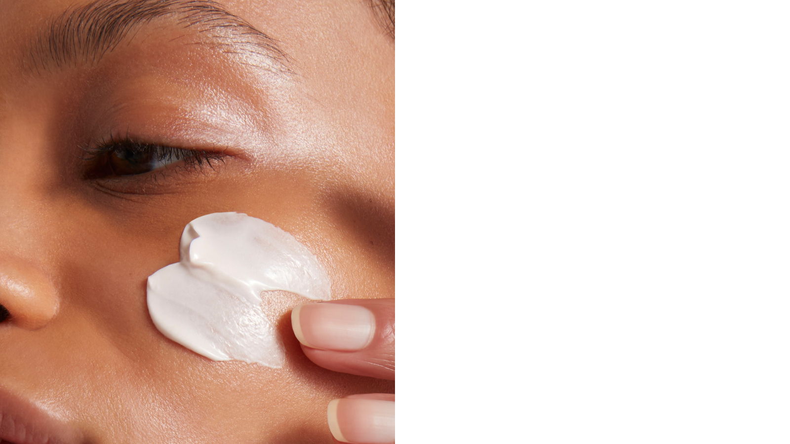 Person applying a skincare product to their face.