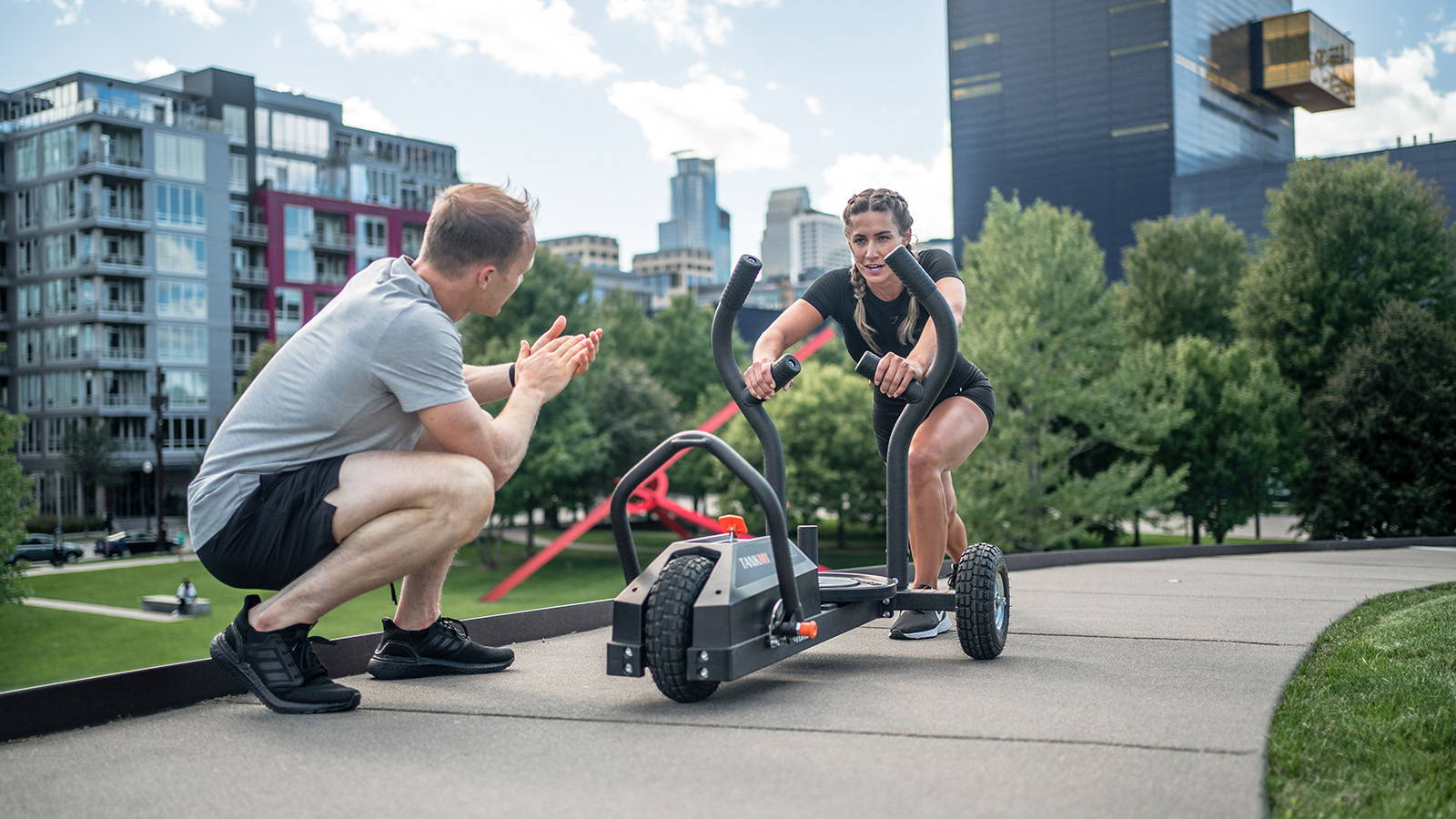 Two people working out using Tank M1 in city