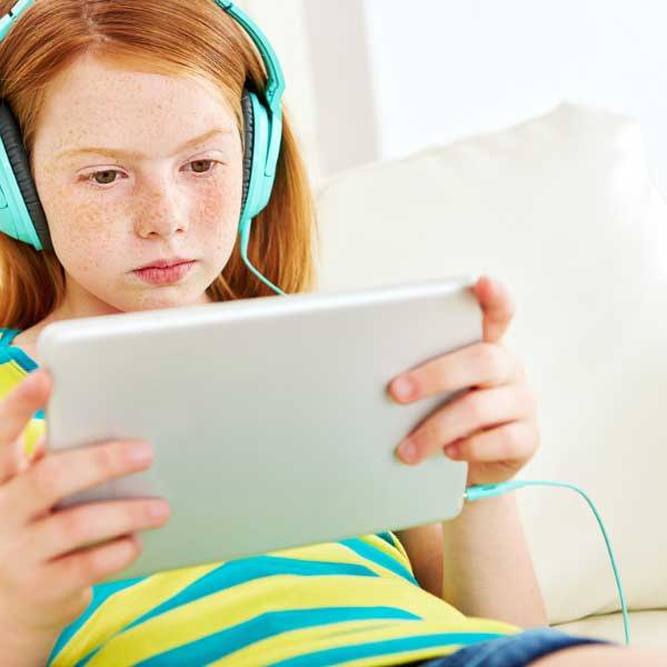 A child sitting only zoned out on a tablet