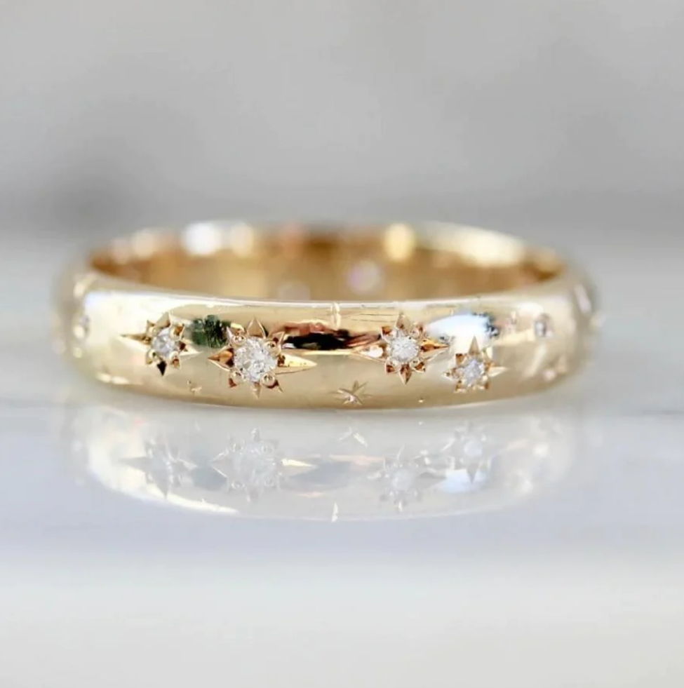Hand-engraving wedding band with stars and star set diamonds