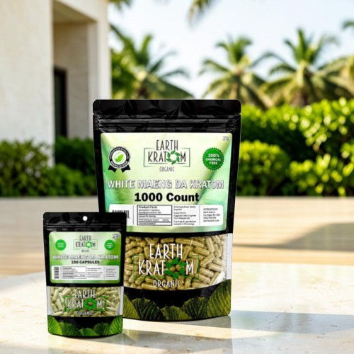 Two packages of plant-based products on a table with greenery in background.
