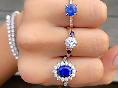 various sapphire engagement rings worn on one hand