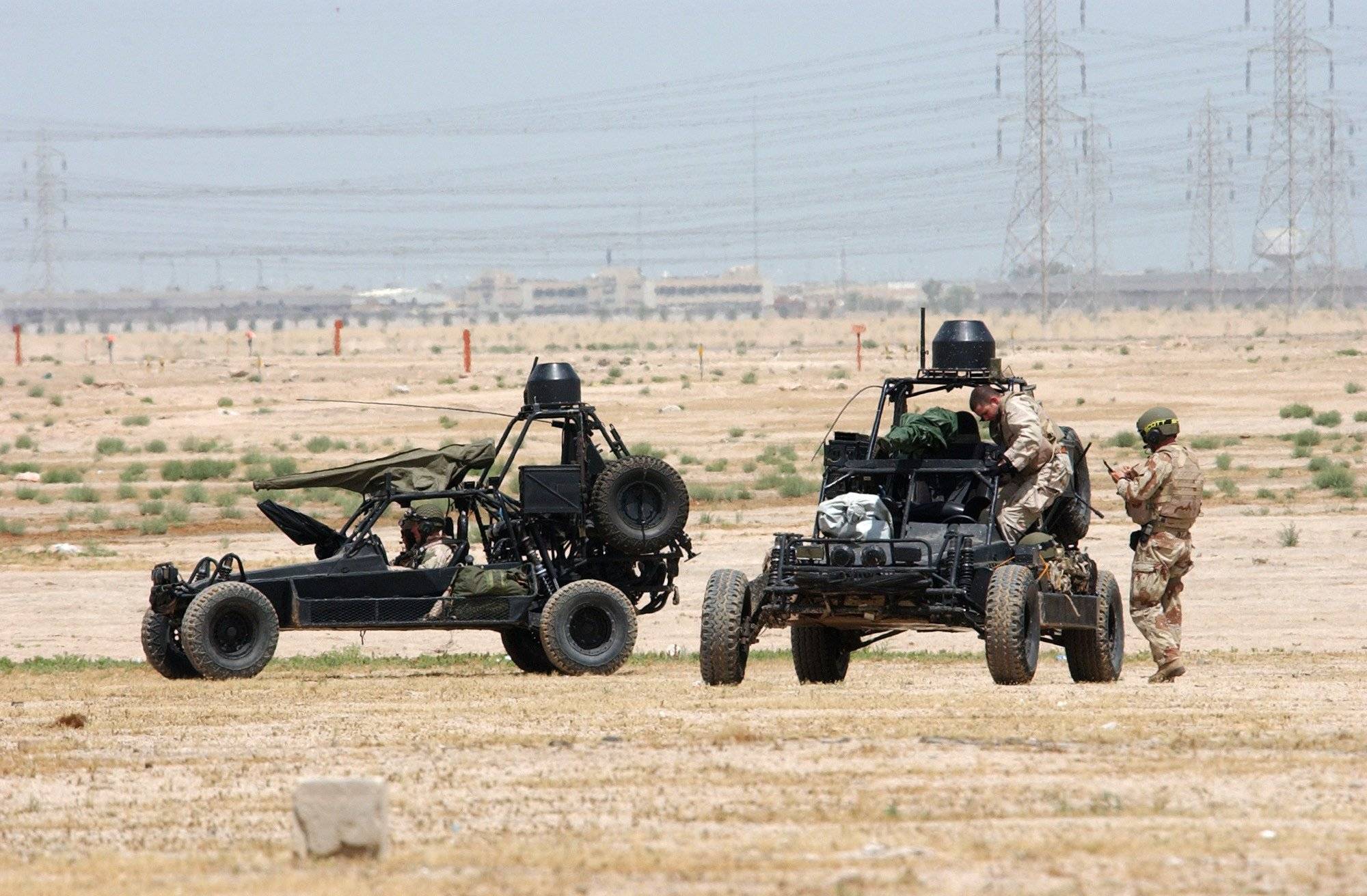 Camp Doha, Kuwait (Feb. 13, 2002) - U.S. Navy SEALs (SEa, Air, Land) operate Desert Patrol Vehicles (DPV) while preparing for an upcoming mission. Each “Dune Buggy