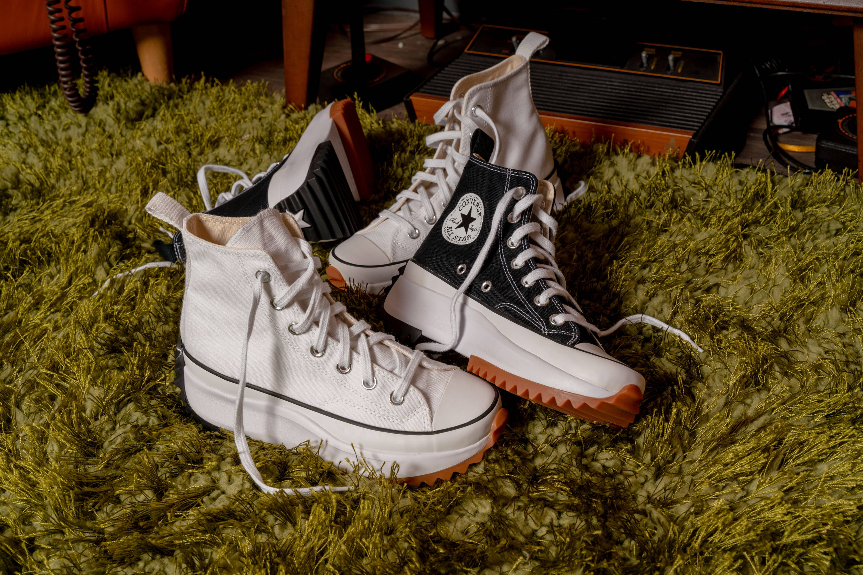 black and white high top converse on carpet