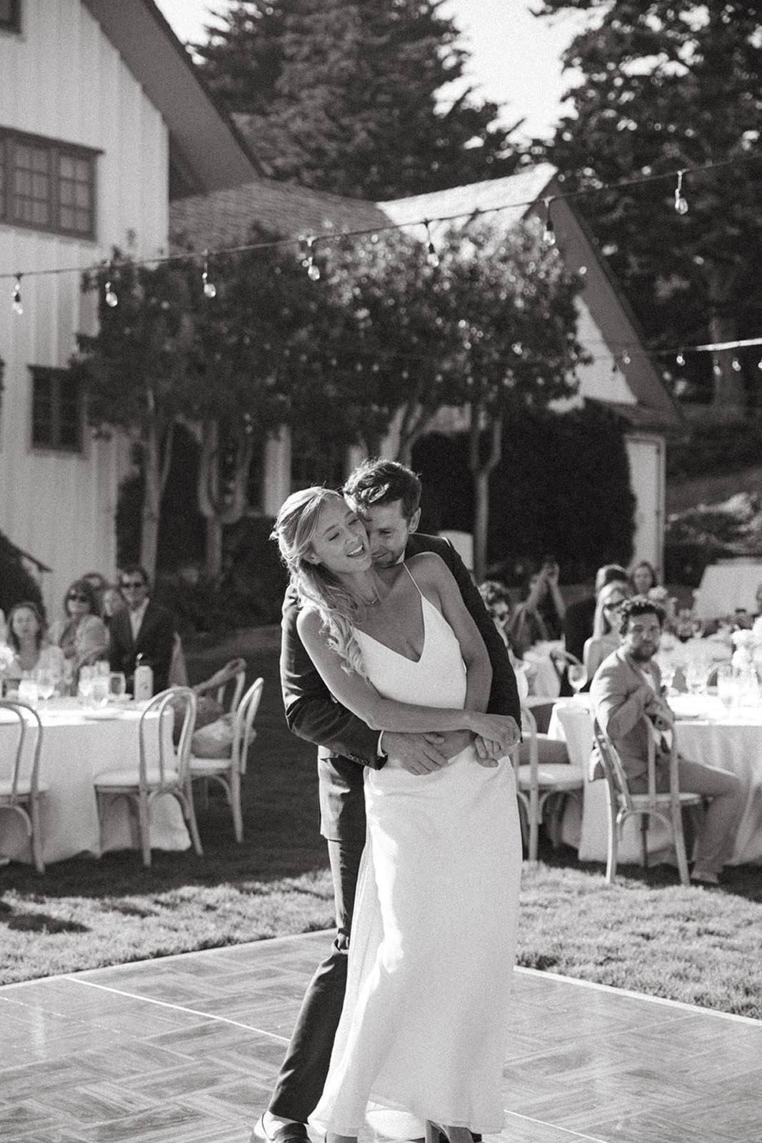 Bride and groom dancing together at wedding reception