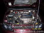 Engine bay Mitsubishi DOHC 16 valve pink intake air filter 1999 Eclipse Shocker XL train horn kit customer install gallery photo 3