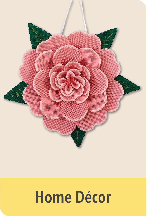 Pink flower decoration with green leaves, labeled 