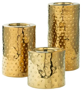 A set of gold candleholders.