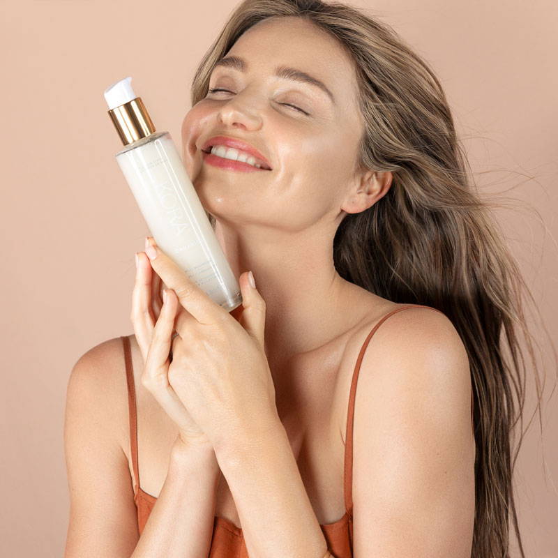 Miranda Kerr holding the Milky Mushroom Gentle Cleansing Oil