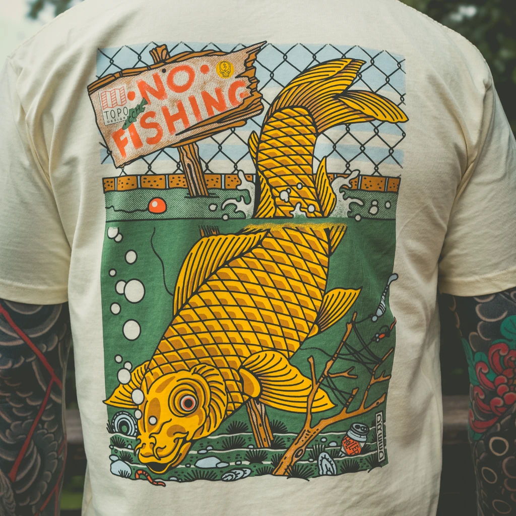 T-shirt design featuring a large yellow fish and 