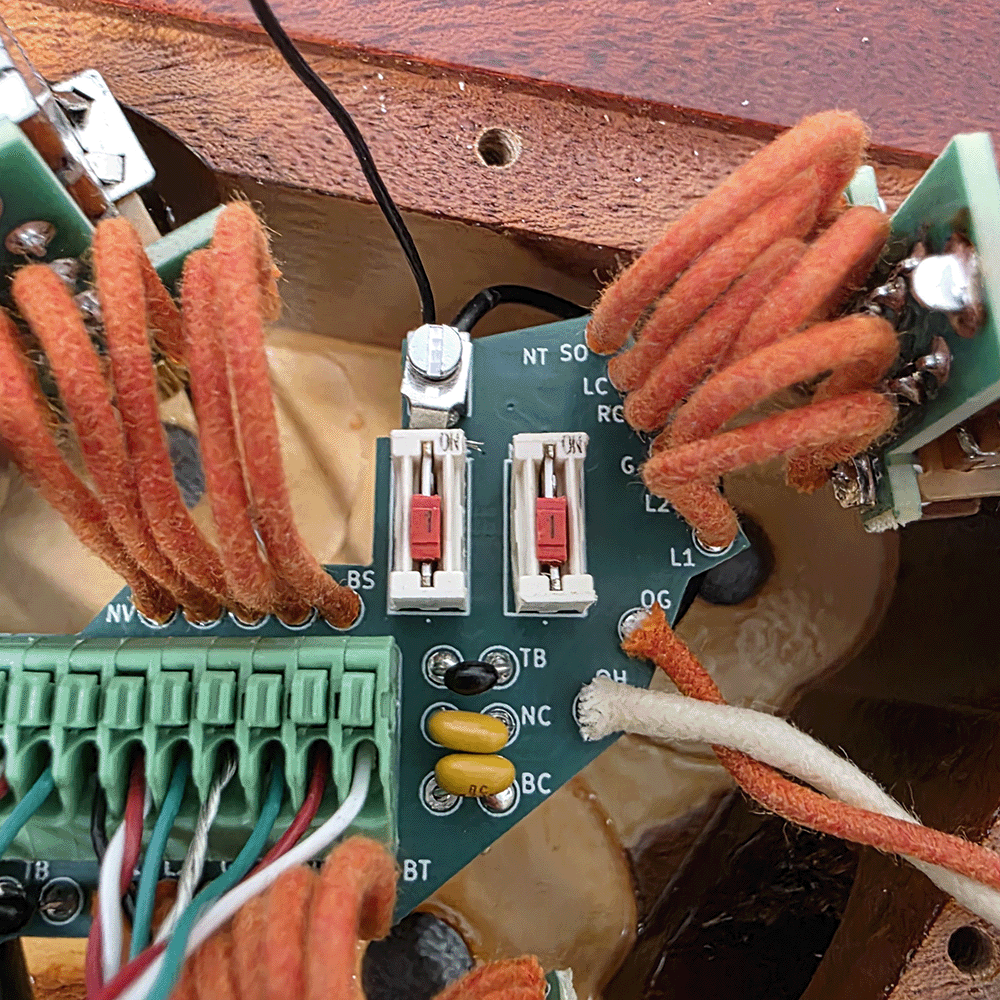 Close-up of a circuit board with wires and connectors.