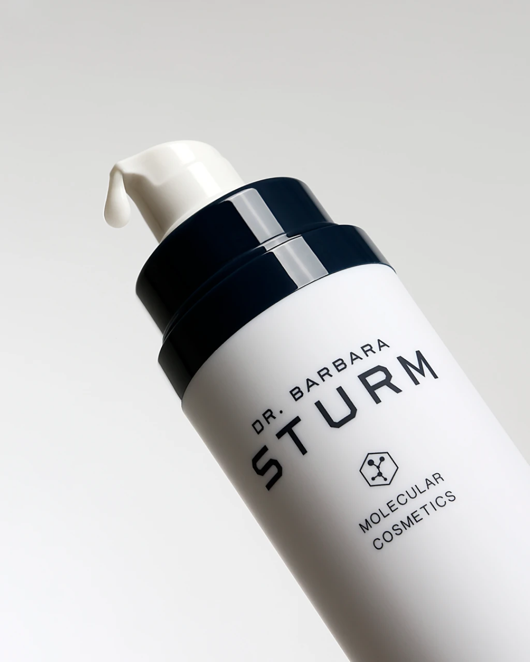 Bottle of Dr. Barbara Sturm molecular cosmetics with pump top.