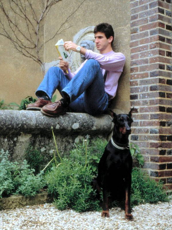 Eric Cantona wears the iconic Paraboot 'Michael' shoes.