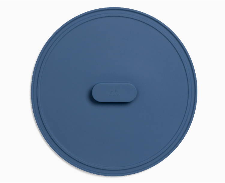 A Blue Misen Universal Lid seen from directly above, with raised central handle visible.