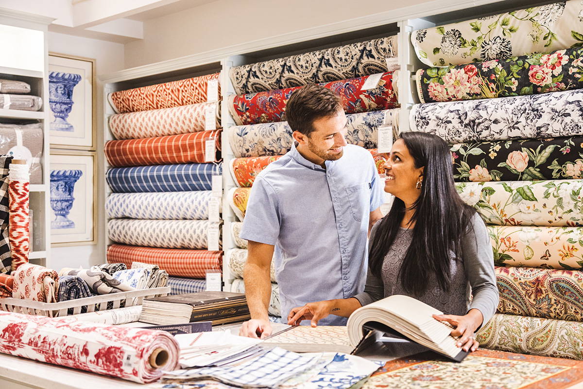 Couple choosing fabrics at Brick & Vine's Design Center