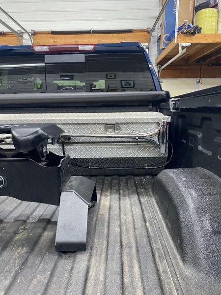 Truck bed view showing the long chrome Mother Trucker 127H air horn mounted against the toolbox in Edward's 2022 Chevy 2500 photo 3