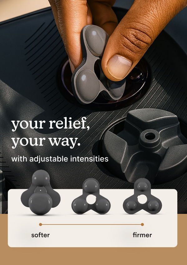 Hand adjusting a device with intensity settings for personal relief.