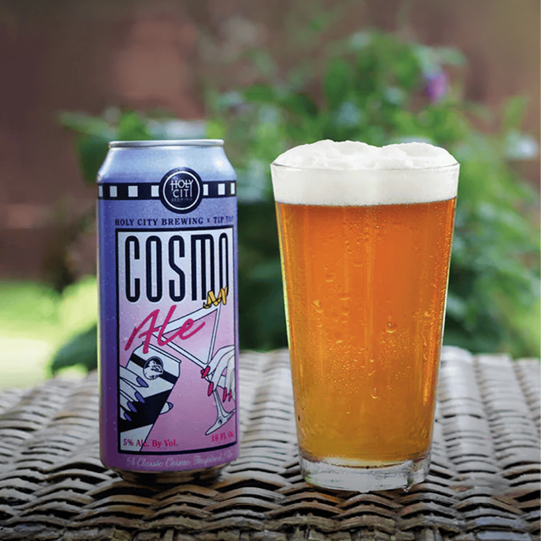 Can of Cosmo Ale next to a glass of beer.