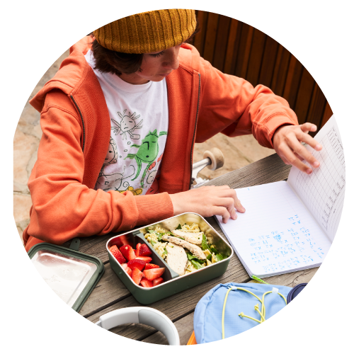 Kid at school eating lunch 