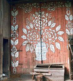 An arts & crafts painted barn door