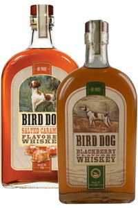 Two bottles of Bird Dog whiskey, Salted Caramel and Blackberry flavors.