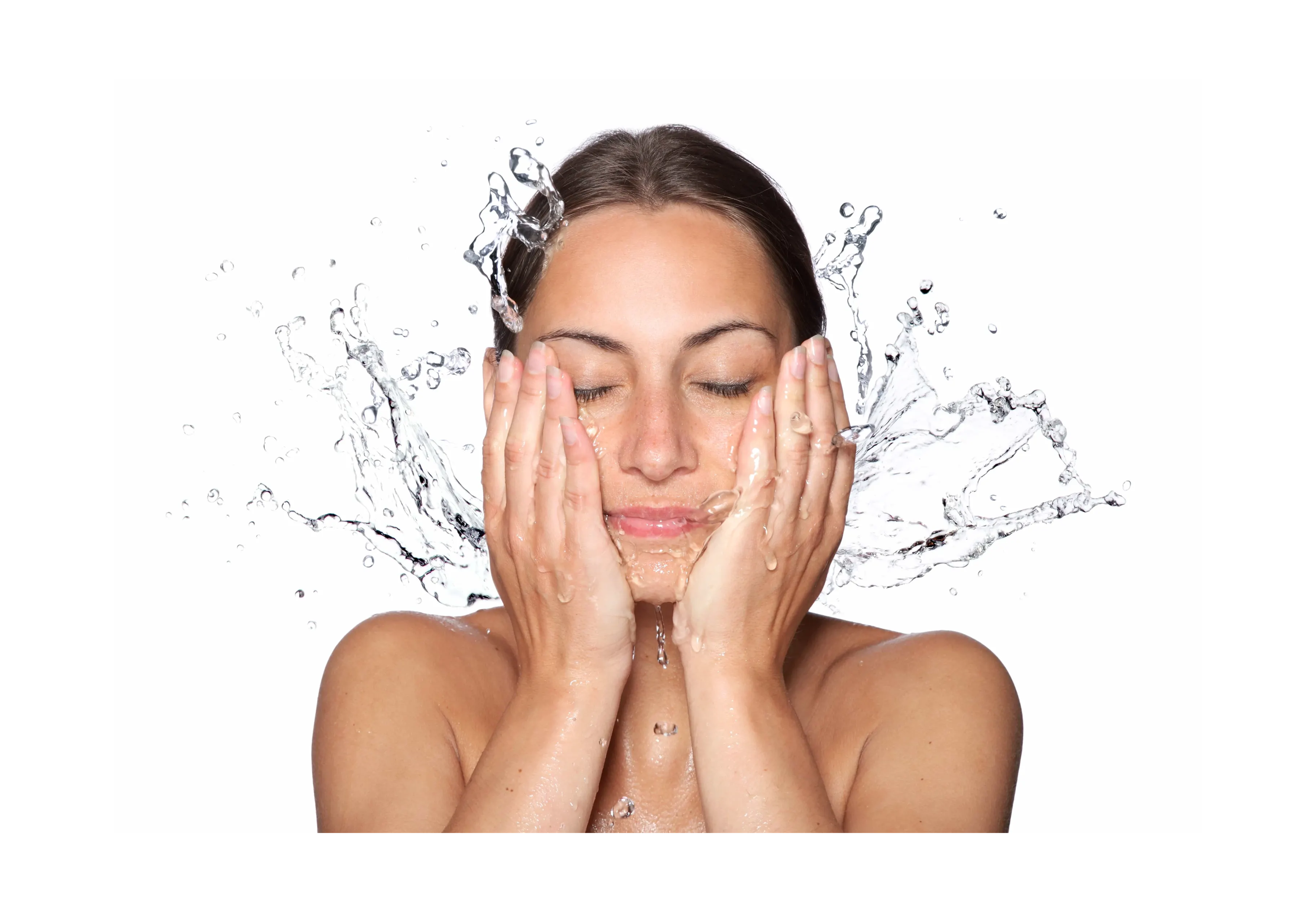 woman splashing water on her face