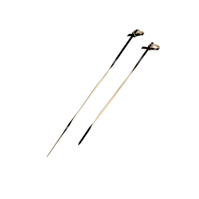Two twisted black bamboo skewers