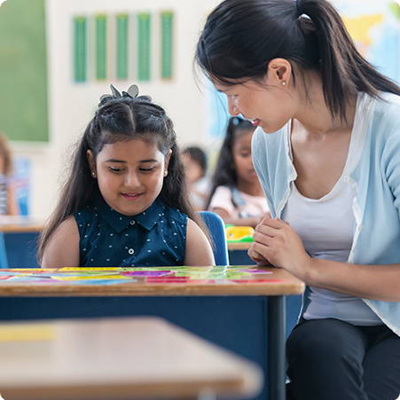 School teacher helping student