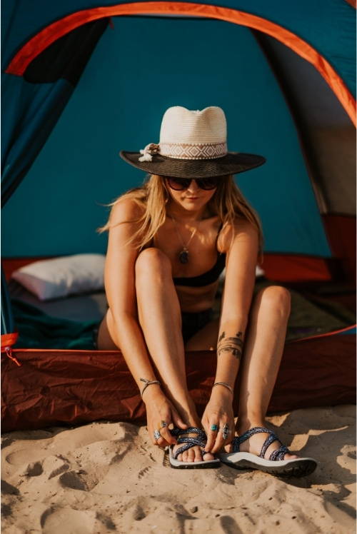 women in tent wearing water sandals