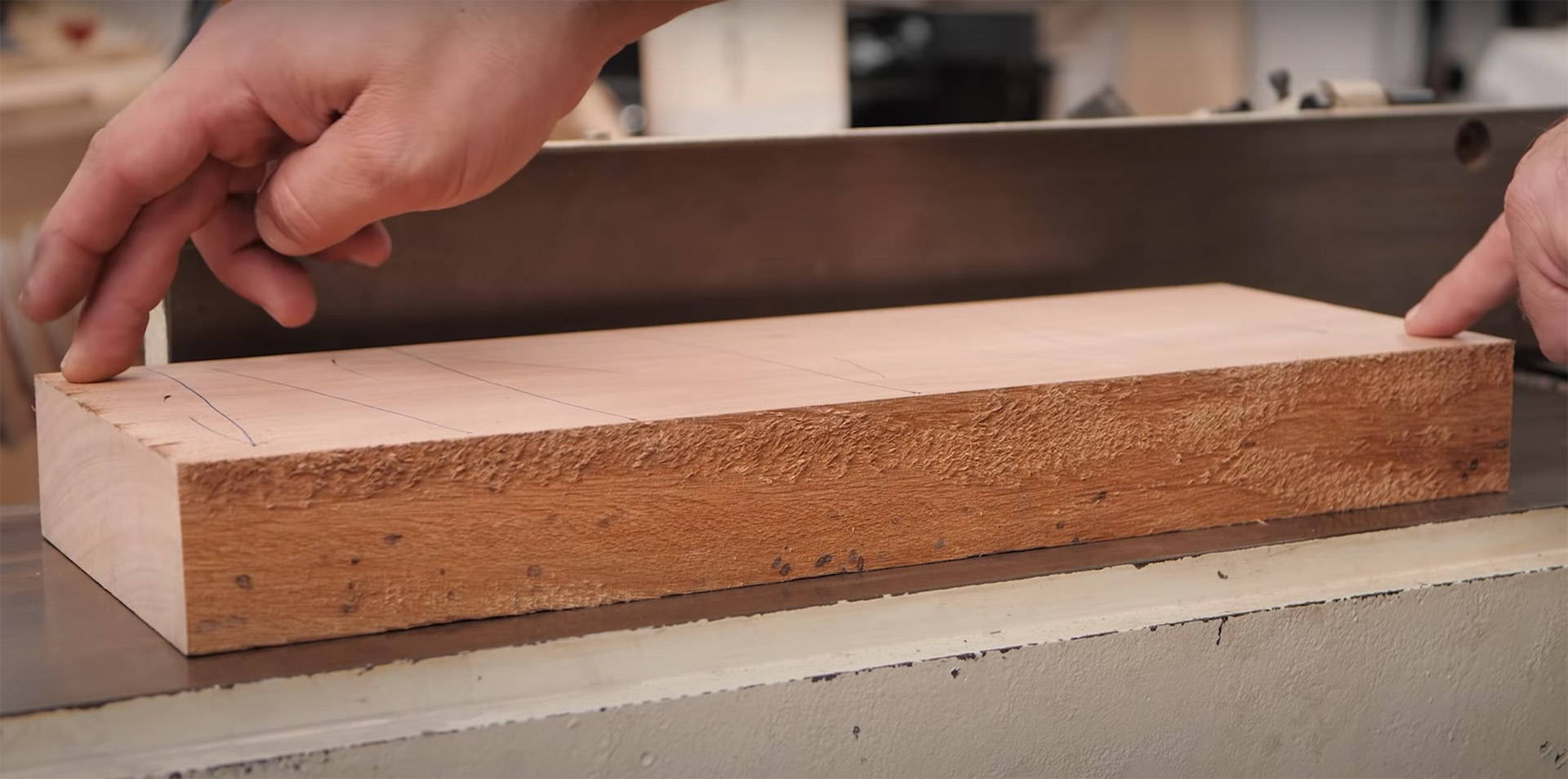 testing a board for twist on a jointer