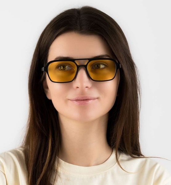 woman wearing Ryder Yellow aviator sunglasses on a white background