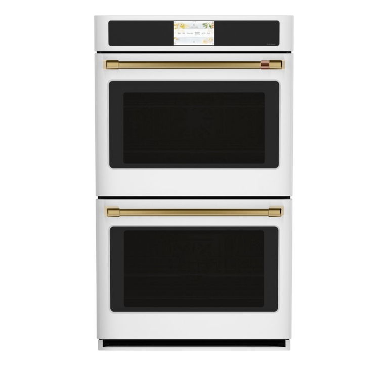 Double oven with a white exterior and gold accents.