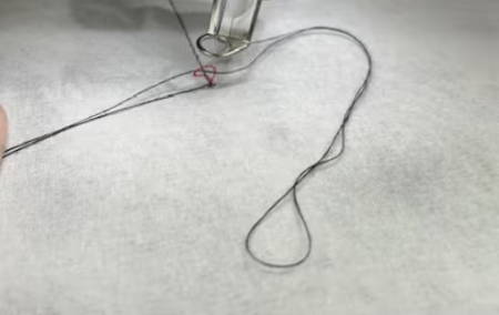 Closeup of two needle thread loops