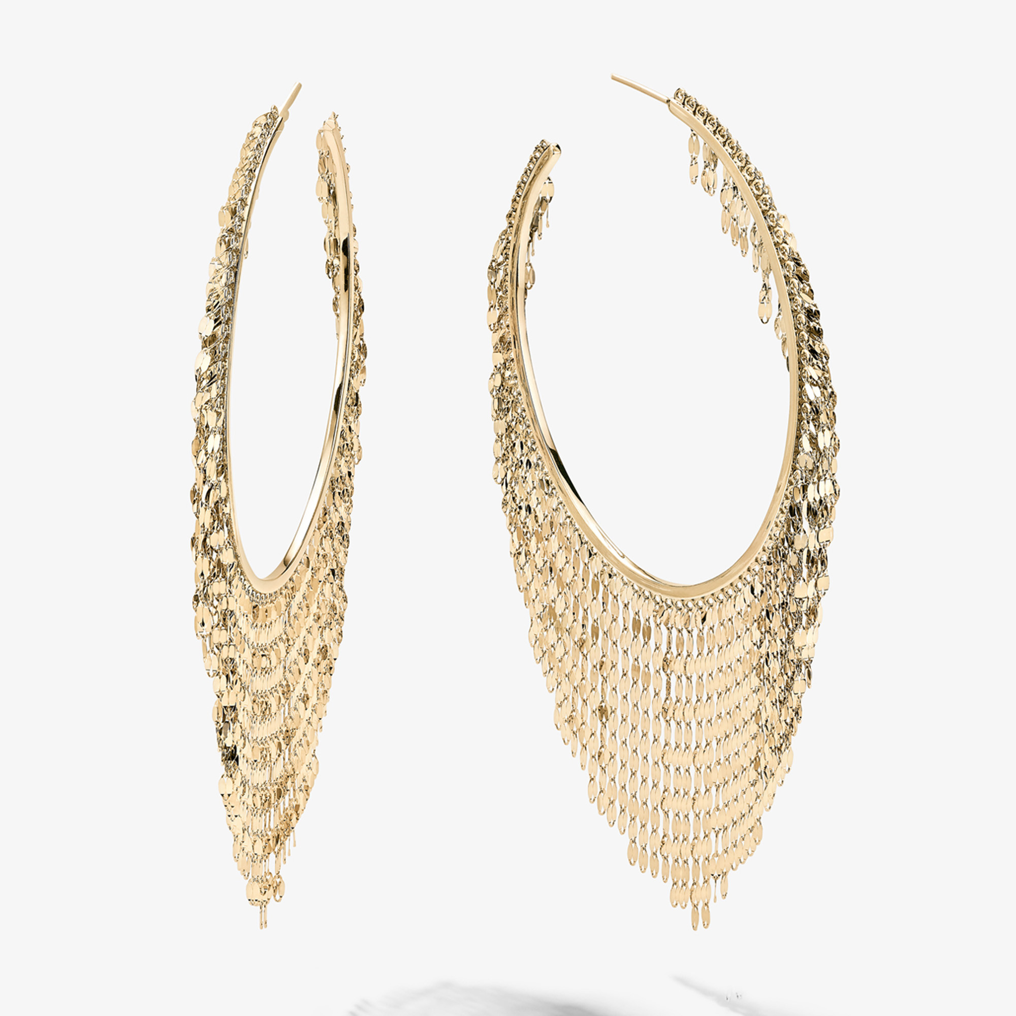 Gold hoop earrings with intricate cascading design.