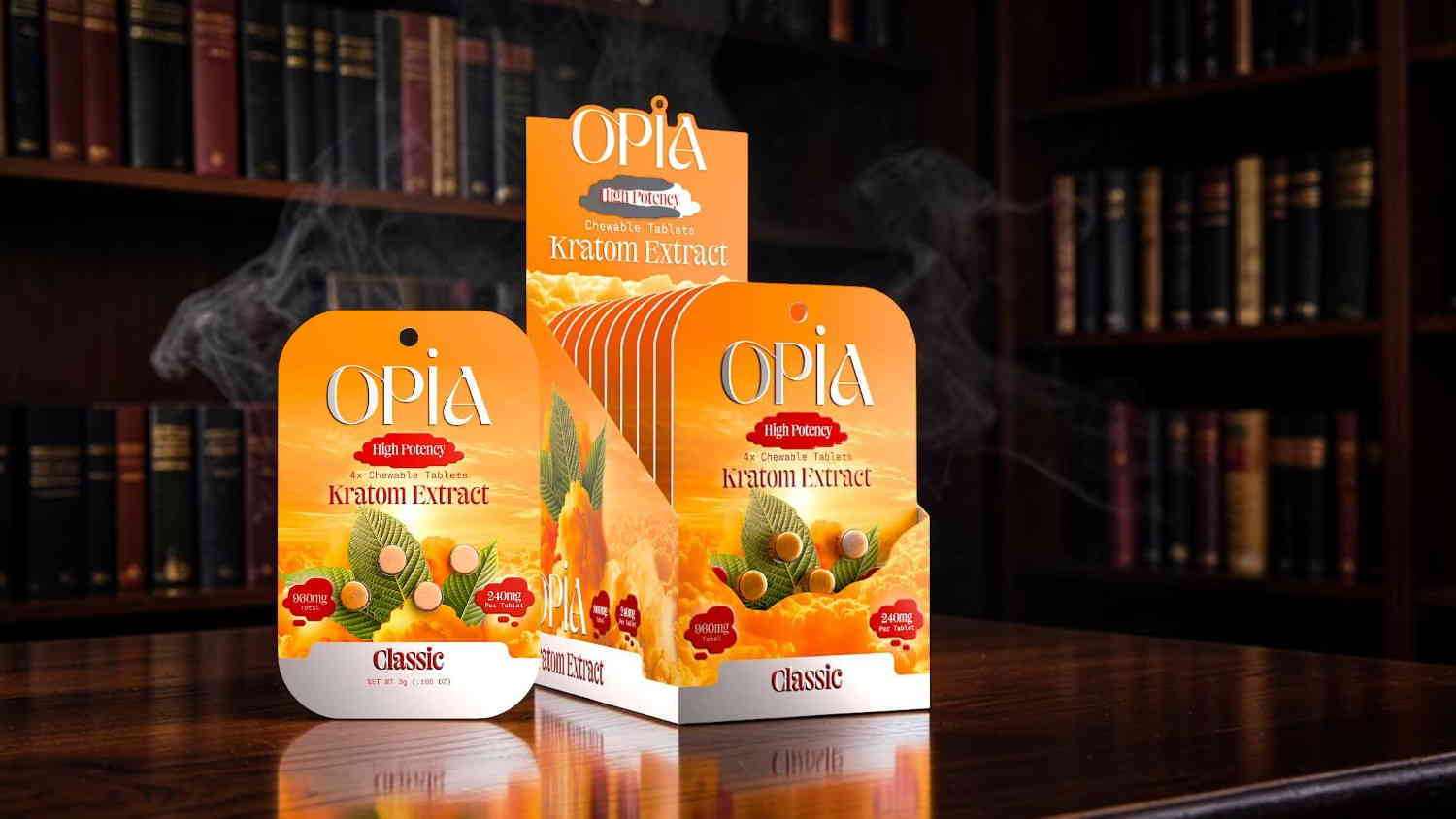 Three packages of flavored tea on a wooden table with books in the background.