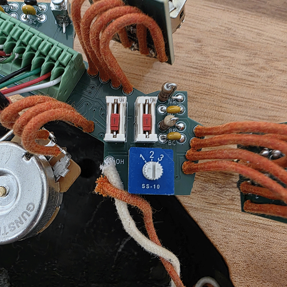 Close-up of a circuit board with wires and components.