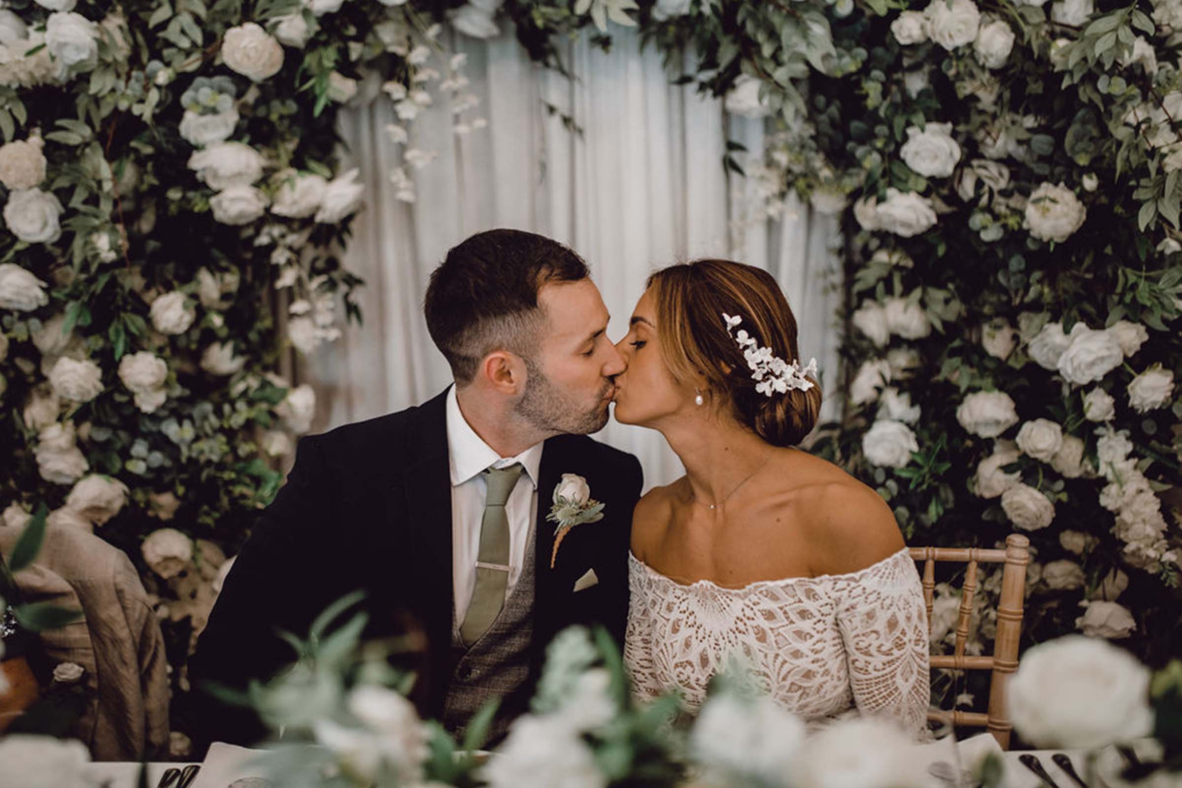 Bride and groom, sharing a kiss