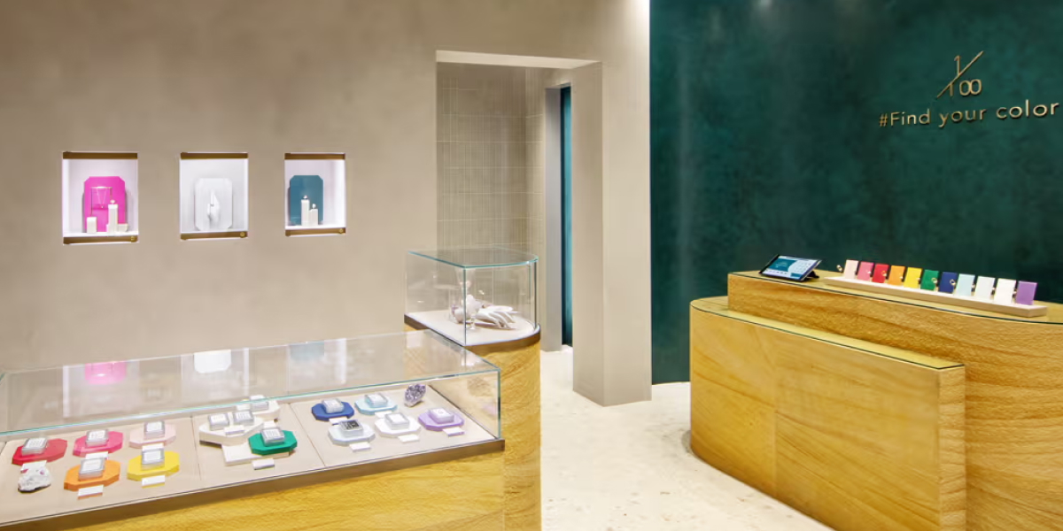 Jewelry store interior with display counters and colorful items for sale.