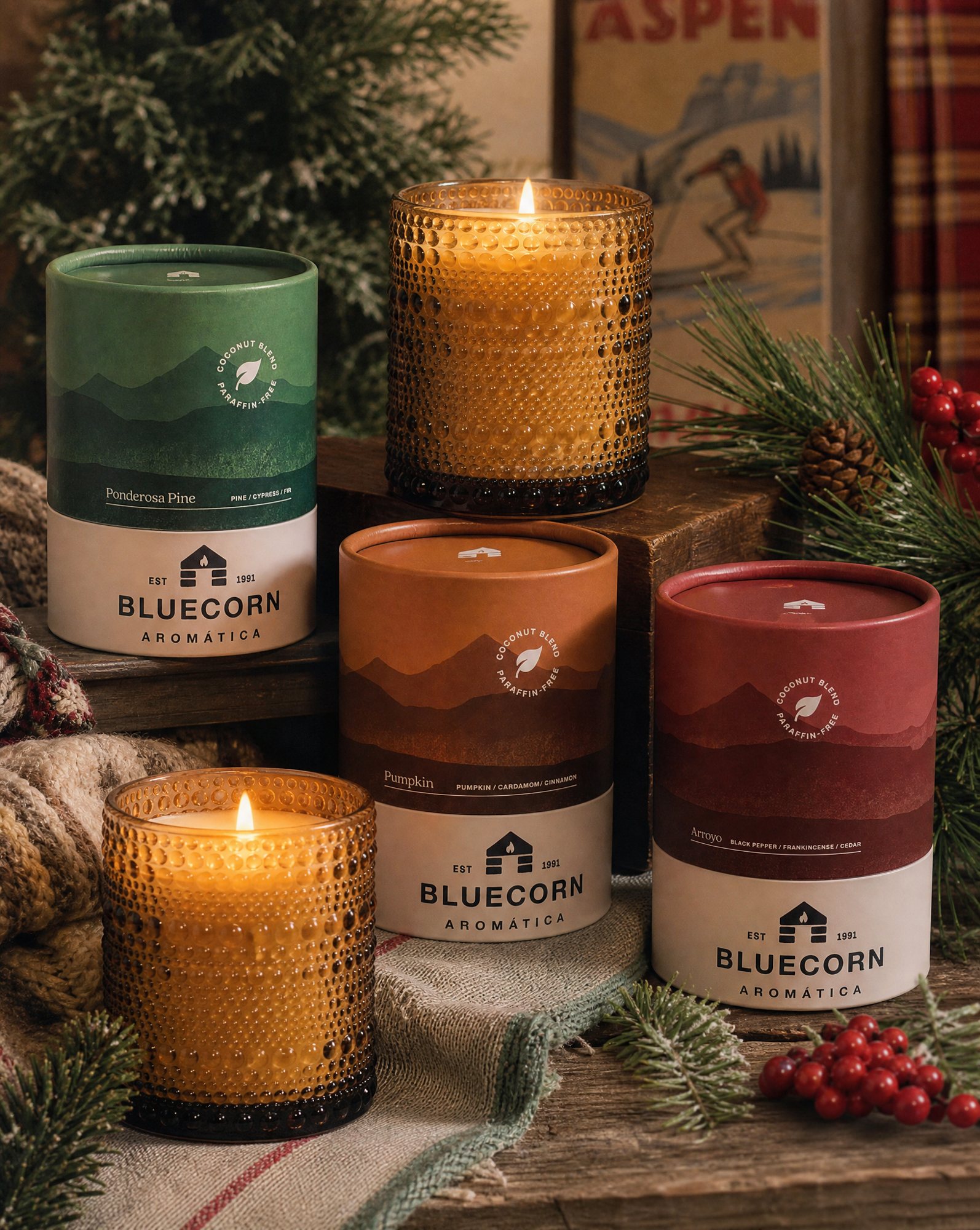 Bluecorn Aromática candles among winter greenery