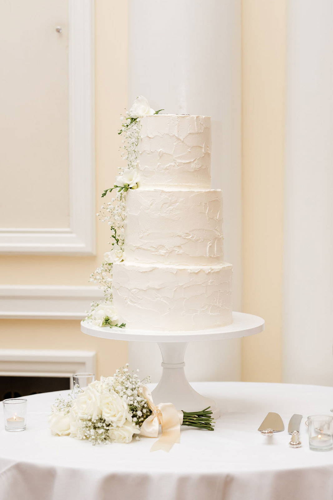 Three tiered wedding cake.