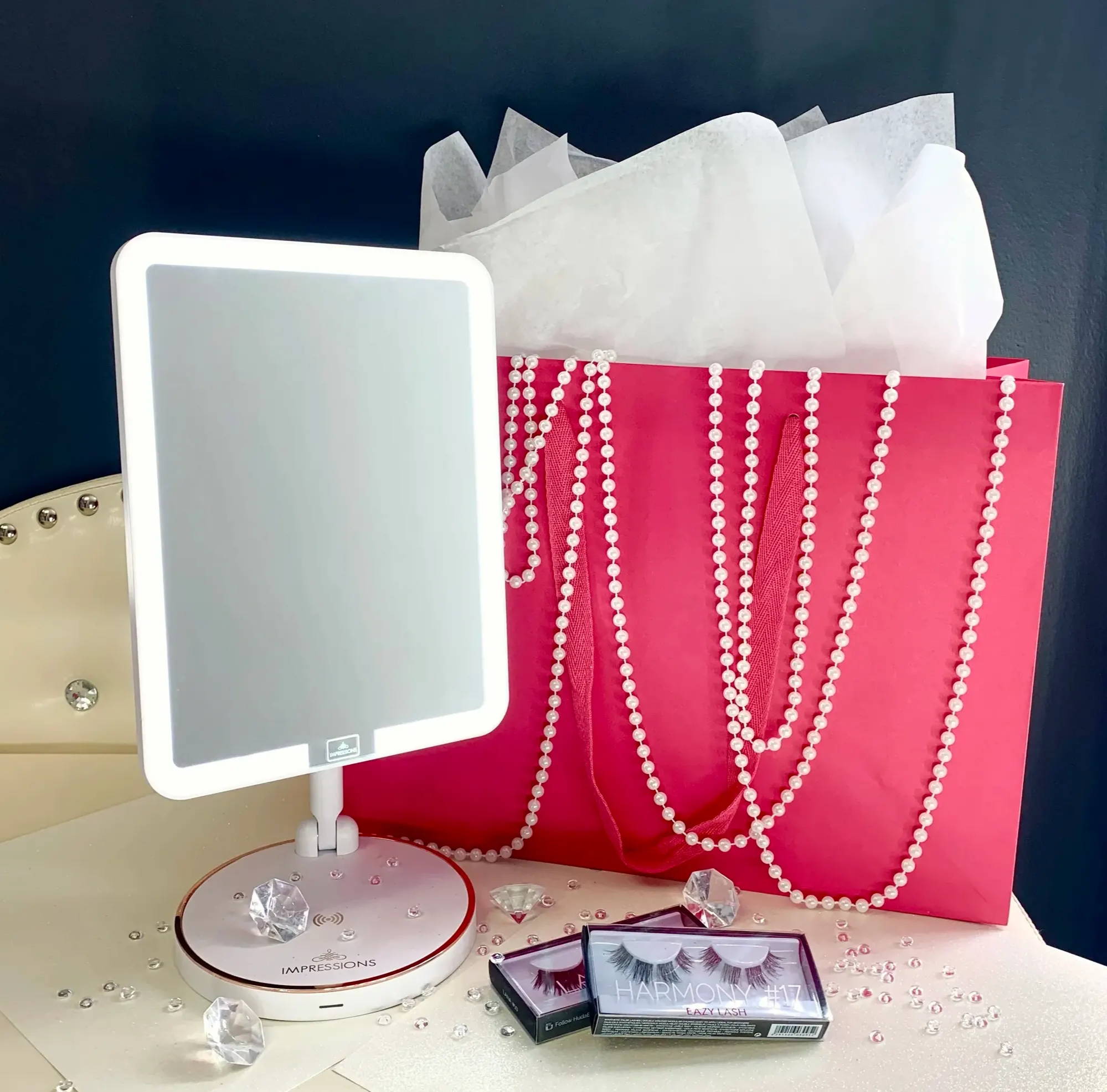 the white royale petit with a pink gift bag