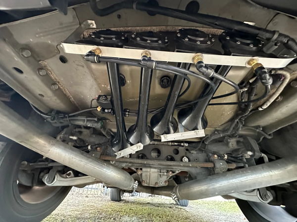 Undercarriage four black Shocker XL train horn trumpets solenoid dual exhaust Jorn's 2014 Jeep WK2 HornBlasters customer install gallery photo 2