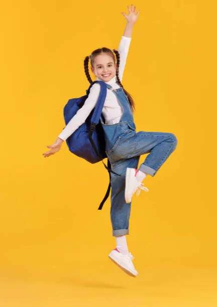 excited girl with backpack