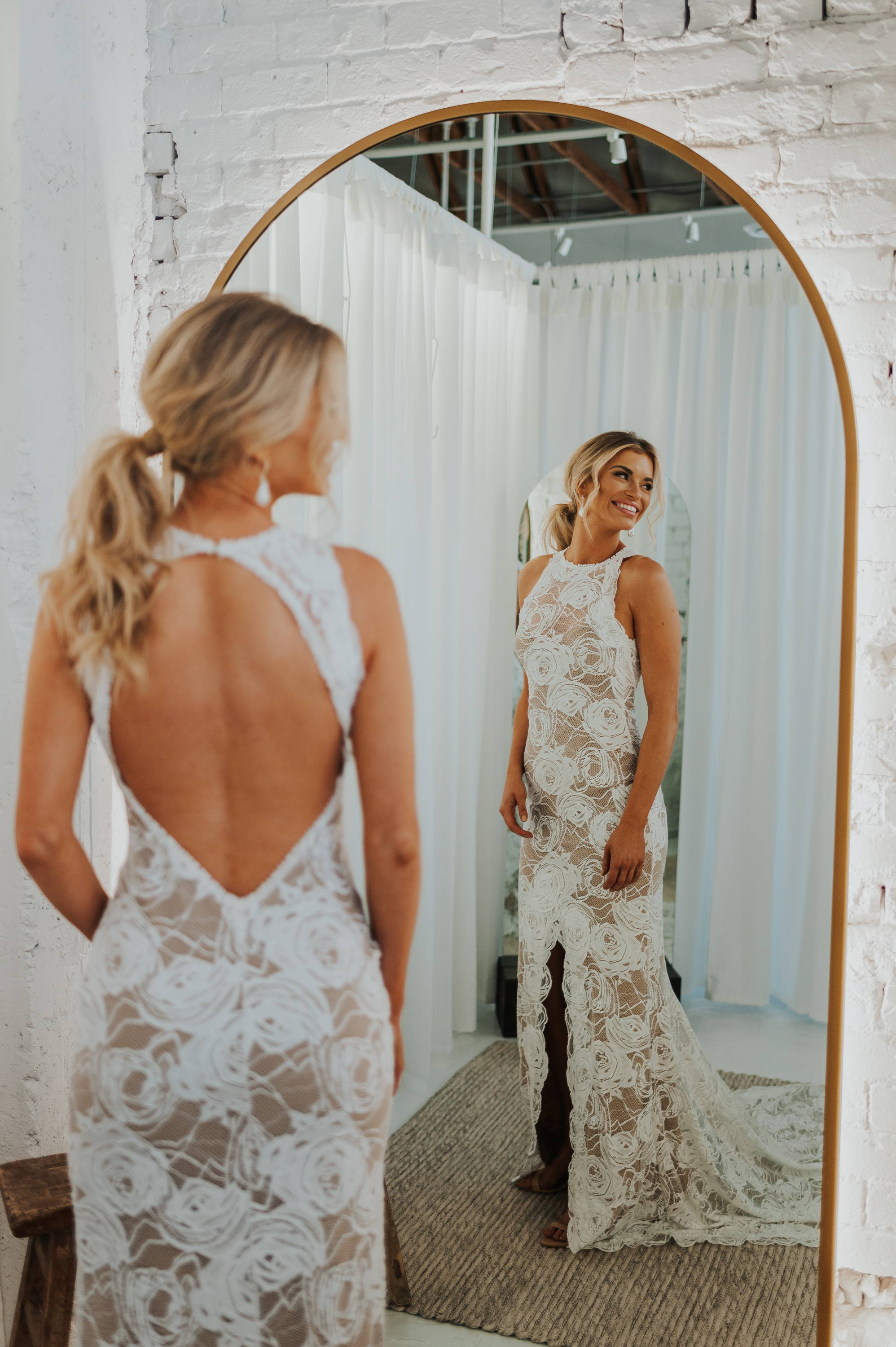 Bride trying on the Chai lined Alexandra wedding dress