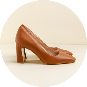 Brown high-heeled shoes on a light background.