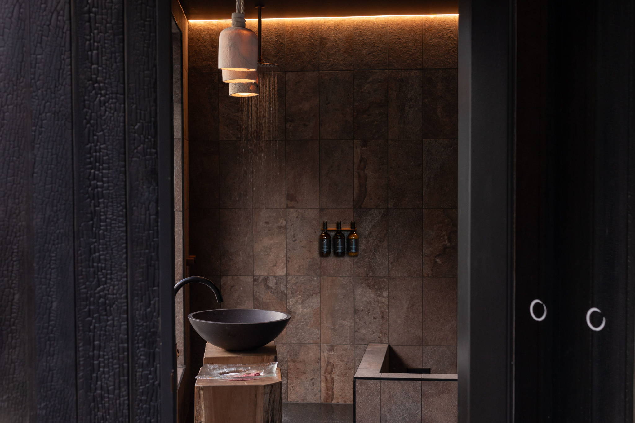 Sol Elements bathroom project fossil coral dome pendants