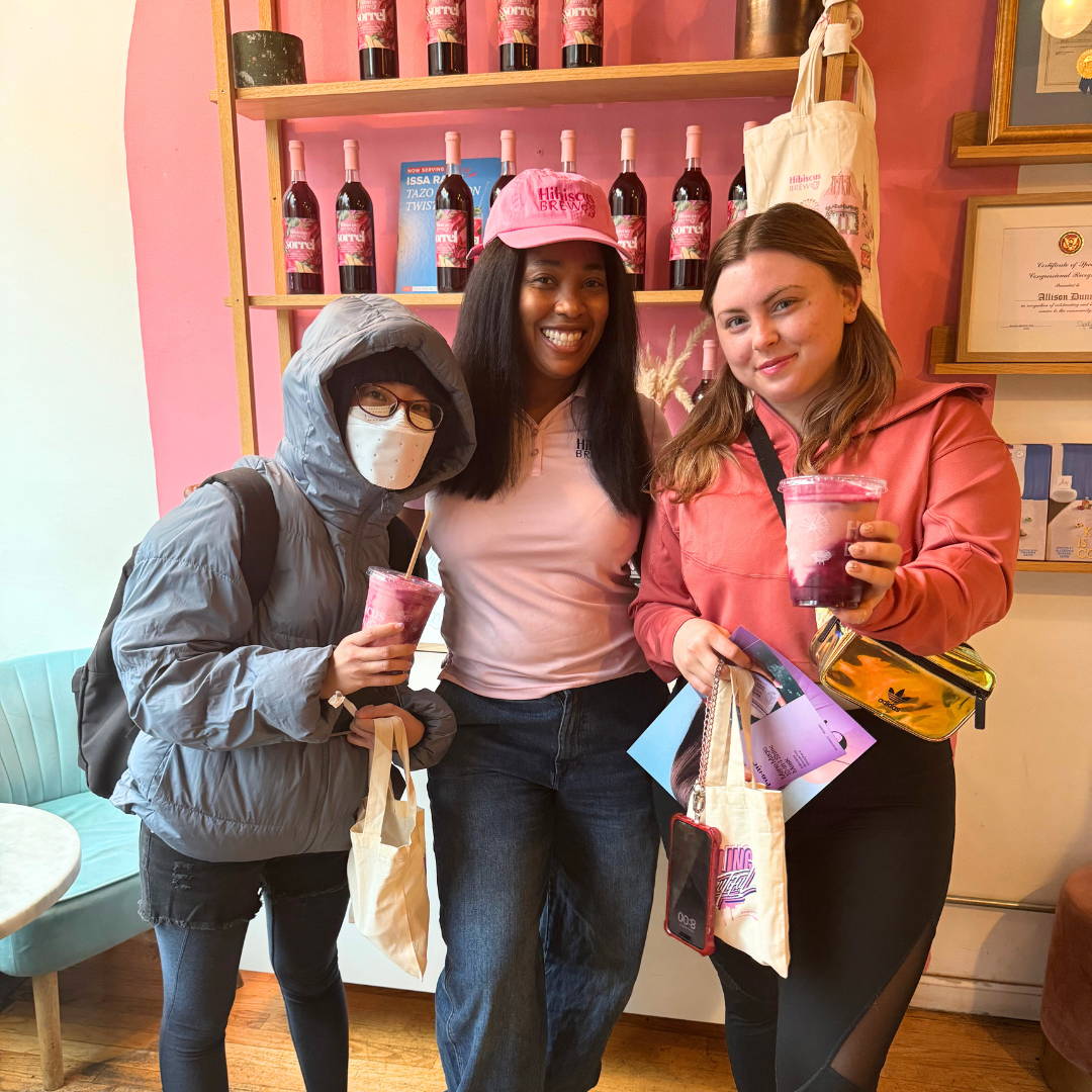 Customers holding Eva NYC and Hibiscus Brew products