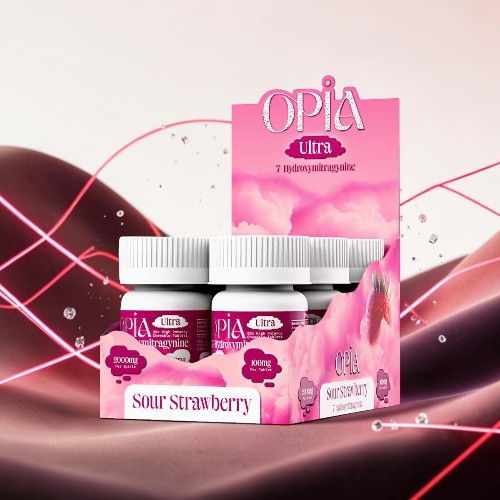 Product display of Opia Ultra Sour Strawberry supplements in a pink box.