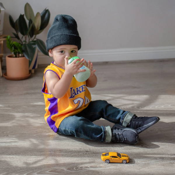 toddler boy in lakers jersey wearing adidas shoes