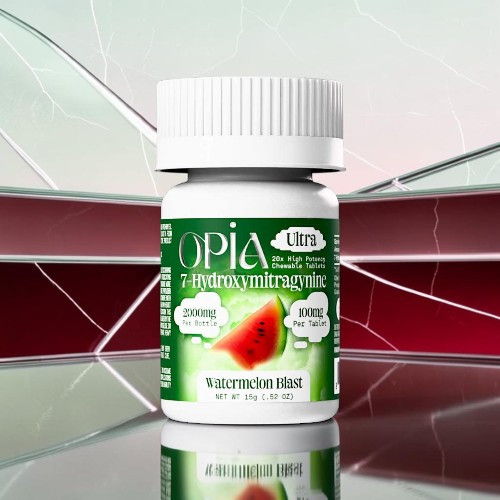 Bottle of Opia dietary supplement with watermelon flavor on reflective surface.